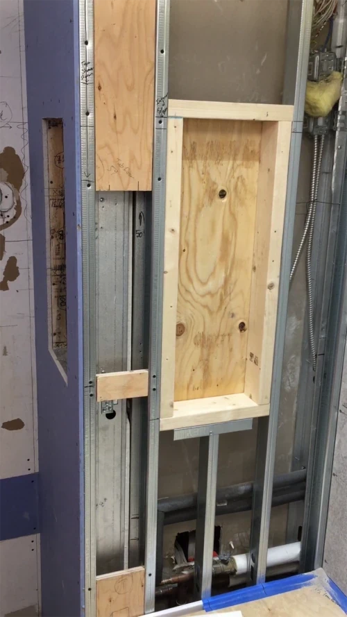 vlcsnap-Utilities behind roughed-in shower niche - shower niche height post
